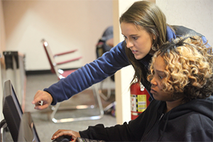 CILO Cincinnati newsletter sign up Women helping another woman use a computer